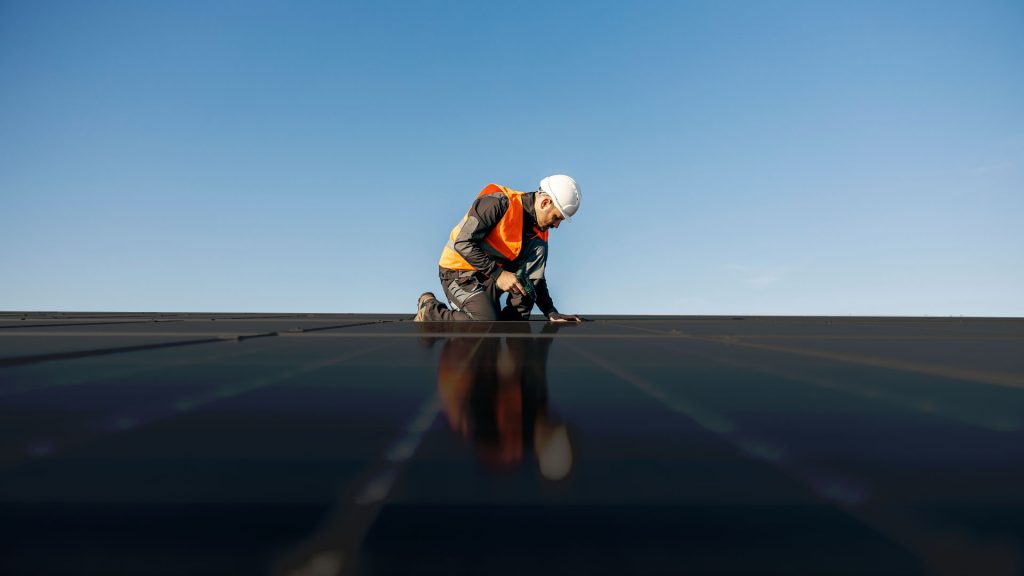 Worker installing Solar Panels